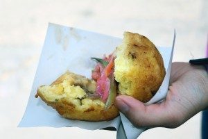 eating-papa-rellena-street-food-in-la-paz-bolivia-300x200